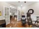 Cozy living room with hardwood floors and French doors leading to another living area at 1831 Middlebrook Dr, Raleigh, NC 27615