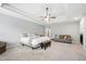 Bright and airy main bedroom boasts a tray ceiling, ceiling fan and ample space for relaxation at 1831 Middlebrook Dr, Raleigh, NC 27615