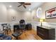 Bright office featuring hardwood floors, large windows, and elegant decor at 1831 Middlebrook Dr, Raleigh, NC 27615