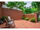 Private brick patio with outdoor seating and surrounding greenery offers a serene and relaxing outdoor space at 1831 Middlebrook Dr, Raleigh, NC 27615