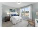 Bright bedroom with two large windows, white bedding, and stylish decor at 2019 Kapalua Way # 200, Durham, NC 27703