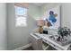 Bright home office nook with a white desk, chair, and a large window at 2019 Kapalua Way # 200, Durham, NC 27703