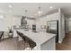 Modern kitchen with a large center island, stainless steel appliances, and pendant lighting at 2019 Kapalua Way # 200, Durham, NC 27703