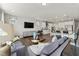 Open concept living room with modern furnishings and a view into the kitchen at 2019 Kapalua Way # 200, Durham, NC 27703