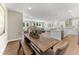 Open concept living space featuring a large dining table, kitchen island, and modern decor at 2019 Kapalua Way # 200, Durham, NC 27703