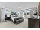 Spacious main bedroom featuring tray ceilings, large windows, and elegant decor at 2019 Kapalua Way # 200, Durham, NC 27703