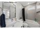 Stylish bathroom featuring a modern vanity, sleek mirror, and a bathtub-shower combo at 219 Woodsborough Pl, Raleigh, NC 27601