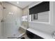 Elegant bathroom with a glass-enclosed shower, built-in bench, and modern fixtures at 219 Woodsborough Pl, Raleigh, NC 27601