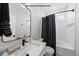 Contemporary bathroom with a sleek vanity, modern fixtures, and a tub-shower combination at 219 Woodsborough Pl, Raleigh, NC 27601