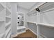 Spacious walk-in closet with ample shelving and hanging space for optimal storage at 219 Woodsborough Pl, Raleigh, NC 27601