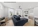 Comfortable living space offering a modern TV, sleek fireplace, and a comfortable sofa at 219 Woodsborough Pl, Raleigh, NC 27601