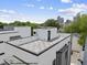 Modern rooftop deck overlooking a cityscape, with sleek design and an inviting outdoor living space at 219 Woodsborough Pl, Raleigh, NC 27601