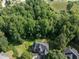 Aerial view of a home with a wooded backyard in a suburban setting at 230 Paula Dr, Angier, NC 27501