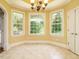 Bright breakfast nook with three windows and tile floors at 230 Paula Dr, Angier, NC 27501