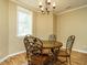 Cozy dining room with a round table and chandelier at 230 Paula Dr, Angier, NC 27501