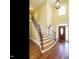 Elegant foyer with hardwood floors, a curved staircase, and a grand chandelier at 230 Paula Dr, Angier, NC 27501