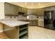 Stylish kitchen with stainless steel appliances and green cabinetry at 230 Paula Dr, Angier, NC 27501