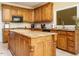 Charming kitchen featuring a large island with light countertops and a window over the sink at 230 Paula Dr, Angier, NC 27501