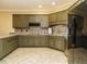 Well-equipped kitchen with granite countertops and stainless steel appliances at 230 Paula Dr, Angier, NC 27501