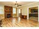 Living room boasts wood floors and a beautiful stone fireplace at 230 Paula Dr, Angier, NC 27501