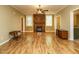 Inviting living room with wood floors and a stone fireplace at 230 Paula Dr, Angier, NC 27501