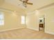 Main bedroom with tray ceiling, large windows and carpet at 230 Paula Dr, Angier, NC 27501