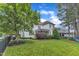 Beautiful backyard with plush lawn, trees, privacy fence and white siding home in the background at 237 Bendemeer Ln, Rolesville, NC 27571