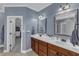 The bathroom features double sinks, and views into the walk-in closet at 237 Bendemeer Ln, Rolesville, NC 27571