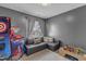 This bedroom has neutral walls, and a sectional couch at 237 Bendemeer Ln, Rolesville, NC 27571