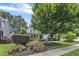 Charming two-story home with a beautifully landscaped front yard and mature trees at 237 Bendemeer Ln, Rolesville, NC 27571