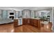 Open-concept kitchen featuring a peninsula island, cherry cabinets, and stainless steel appliances at 237 Bendemeer Ln, Rolesville, NC 27571