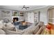 Inviting living room featuring a comfortable sectional, fireplace, and built-in shelving at 237 Bendemeer Ln, Rolesville, NC 27571