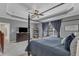 Lovely main bedroom boasts a trey ceiling, ceiling fan, and large windows at 237 Bendemeer Ln, Rolesville, NC 27571