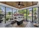 Screened in porch with ceiling fan and outdoor furniture at 237 Bendemeer Ln, Rolesville, NC 27571