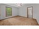 Bedroom featuring carpet, a window, and a view to another room at 2382 Council Rd, Graham, NC 27253