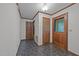 The entryway has a tiled floor, two wood paneled doors, and neutral color walls at 2382 Council Rd, Graham, NC 27253
