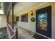 Inviting front porch features a swing, lantern, and door with a decorative wreath at 2382 Council Rd, Graham, NC 27253
