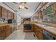 Spacious kitchen featuring ample counter space, wood cabinets, and views into the living room at 2382 Council Rd, Graham, NC 27253