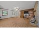 Comfortable living room with large built-in shelving, ceiling fan, and lots of natural light at 2382 Council Rd, Graham, NC 27253