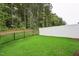 Spacious backyard featuring a manicured lawn and privacy fences, perfect for outdoor activities at 241 White Oak Ridge Dr, Garner, NC 27529