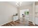 Bright Dining Room featuring wood floors, modern chandelier, and view to the home office space at 241 White Oak Ridge Dr, Garner, NC 27529
