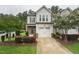 Charming two-story home with a one car garage, landscaped front yard, and inviting curb appeal at 241 White Oak Ridge Dr, Garner, NC 27529