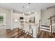 Modern kitchen with white cabinets, stainless appliances, and granite countertops and an island at 241 White Oak Ridge Dr, Garner, NC 27529