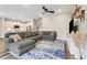 Comfortable living room with a large sectional sofa, stylish rug, and adjacent to the modern kitchen at 241 White Oak Ridge Dr, Garner, NC 27529