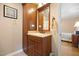 Bathroom featuring a marble countertop sink and wooden cabinet at 2523 Lovette Ln, Graham, NC 27253