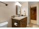 Bathroom featuring vanity with granite countertop, wood cabinets, and framed mirror at 2523 Lovette Ln, Graham, NC 27253