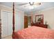 Inviting bedroom featuring a four-poster bed, adjacent closet and a matching dresser at 2523 Lovette Ln, Graham, NC 27253