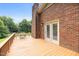 Spacious outdoor deck with seating, perfect for entertaining or relaxing while enjoying the surrounding greenery at 2523 Lovette Ln, Graham, NC 27253