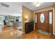 Inviting foyer featuring hardwood floors, decorative accents, and a glimpse into the home's interior layout at 2523 Lovette Ln, Graham, NC 27253