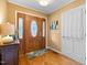 Inviting foyer with hardwood floors, a decorative front door with sidelights, and a glimpse of the home's interior at 2523 Lovette Ln, Graham, NC 27253